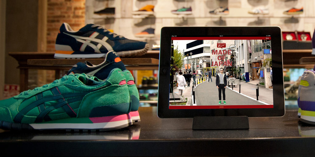 Asics app shown on touch screen in retail space